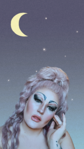 A person with pink hair is shown in a head and shoulders shot against a dusky blue background with stars and a crescent moon.